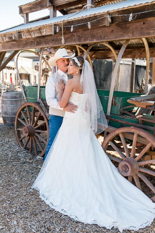 bride and groom portrait with an old wagon at long branch