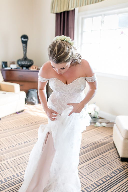 bride fluffing her dress
