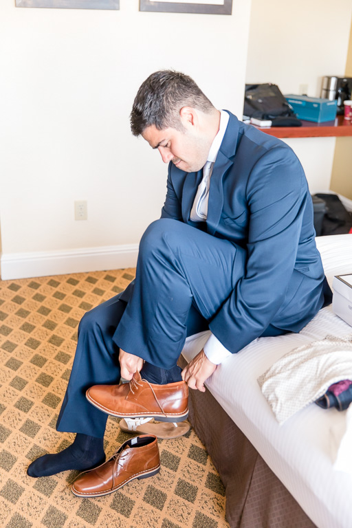 groom wearing his shoes