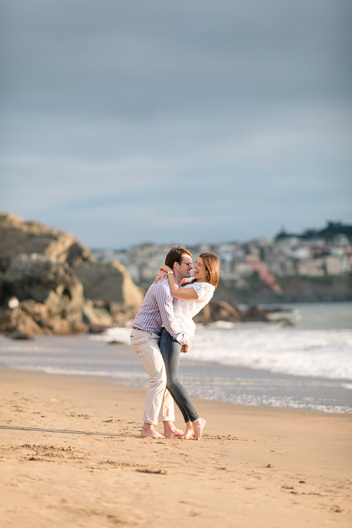 sand beach engagement photo by the shoreline