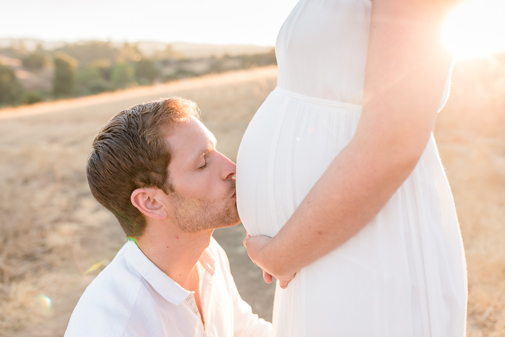 kissing the cute baby bump - bay area maternity portrait
