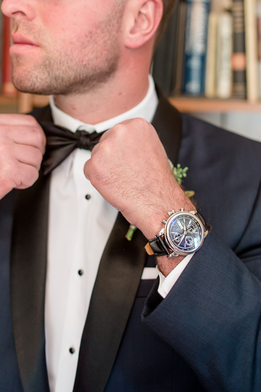 close up of the groom's accessories