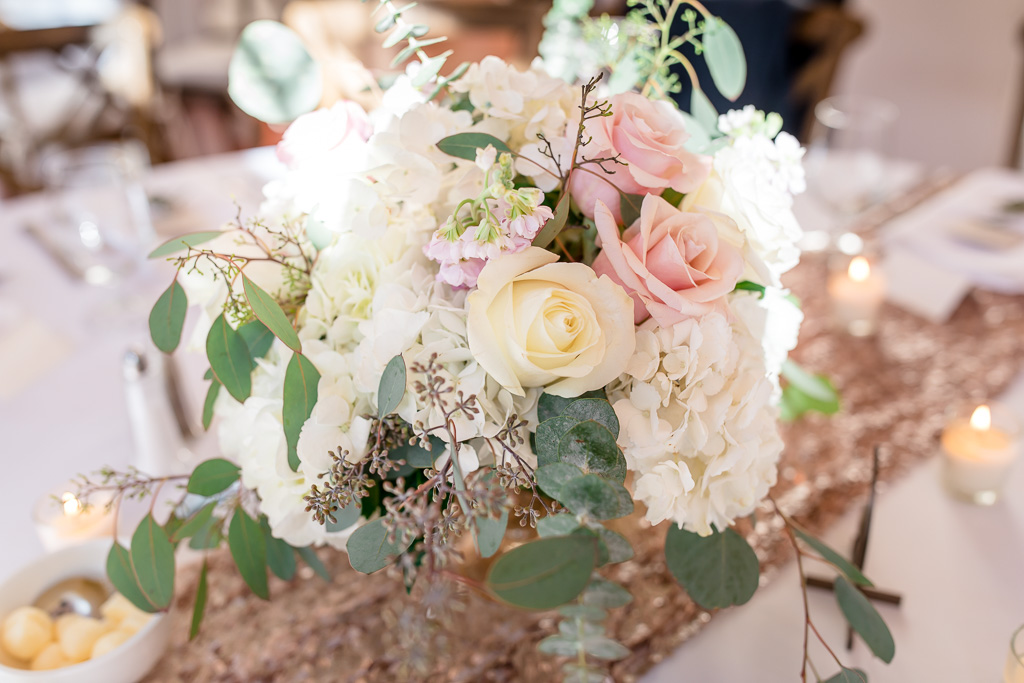 floral centerpiece on wedding guest tables