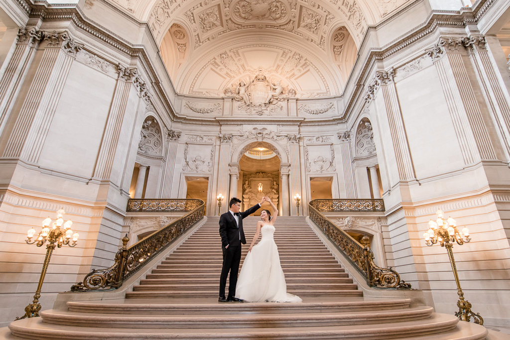 dramatic san francisco city hall wedding photo on the grand staircase
