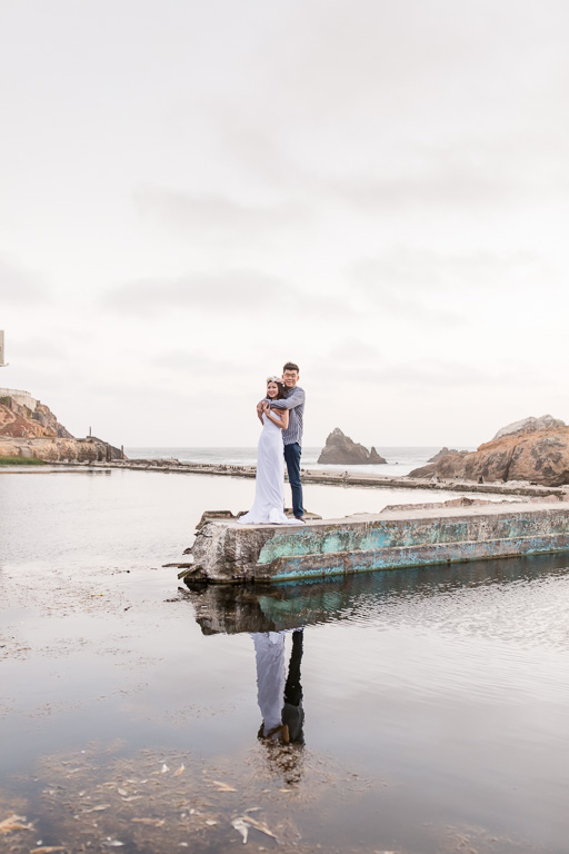 couple photo by the water with reflection