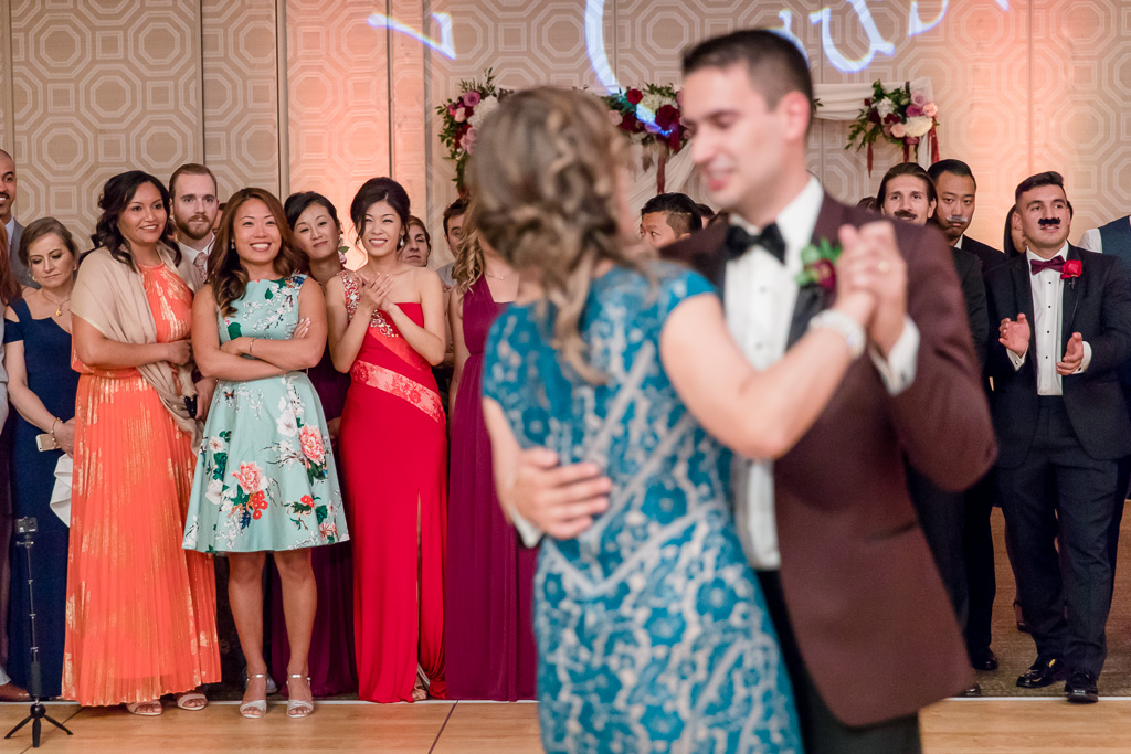 bride's reaction to groom and mother dance