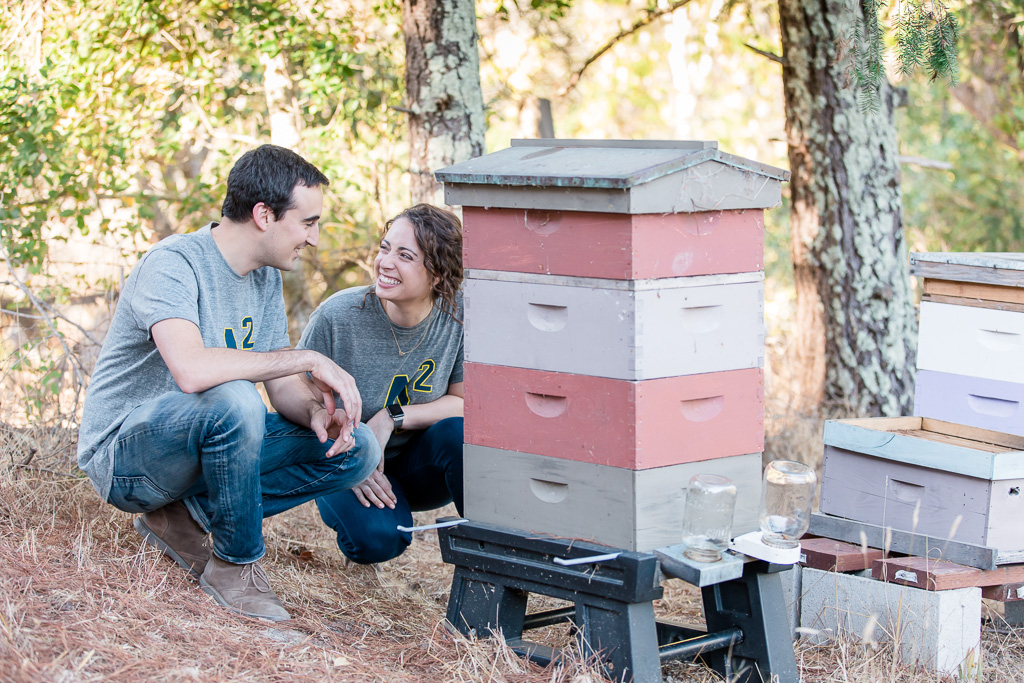 couple with their bee hives