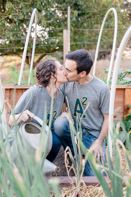 cute engagement photo taken at couple's vegetable garden