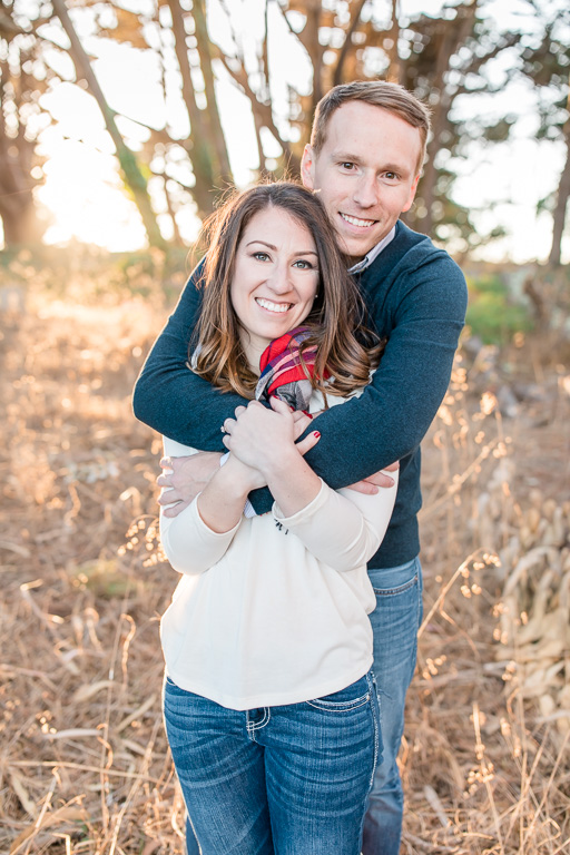 couple photos in woods with golden sun backlighting