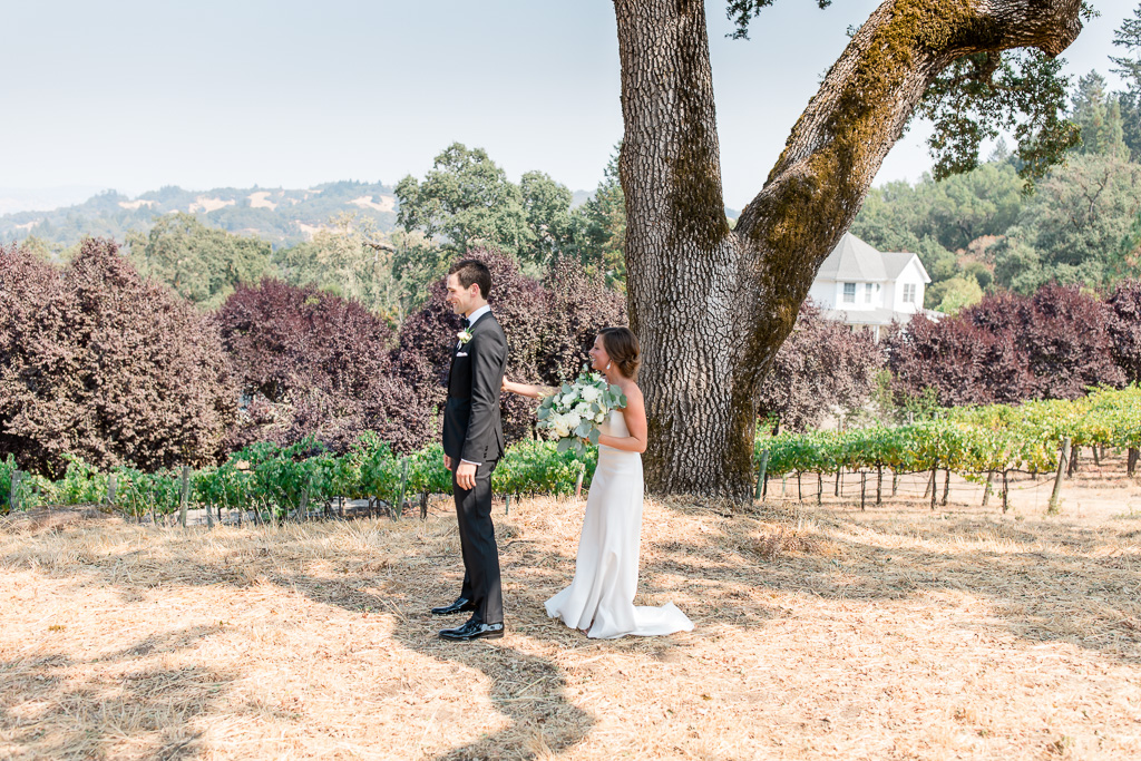a cute first look on a scenic hill overlooking the mountains