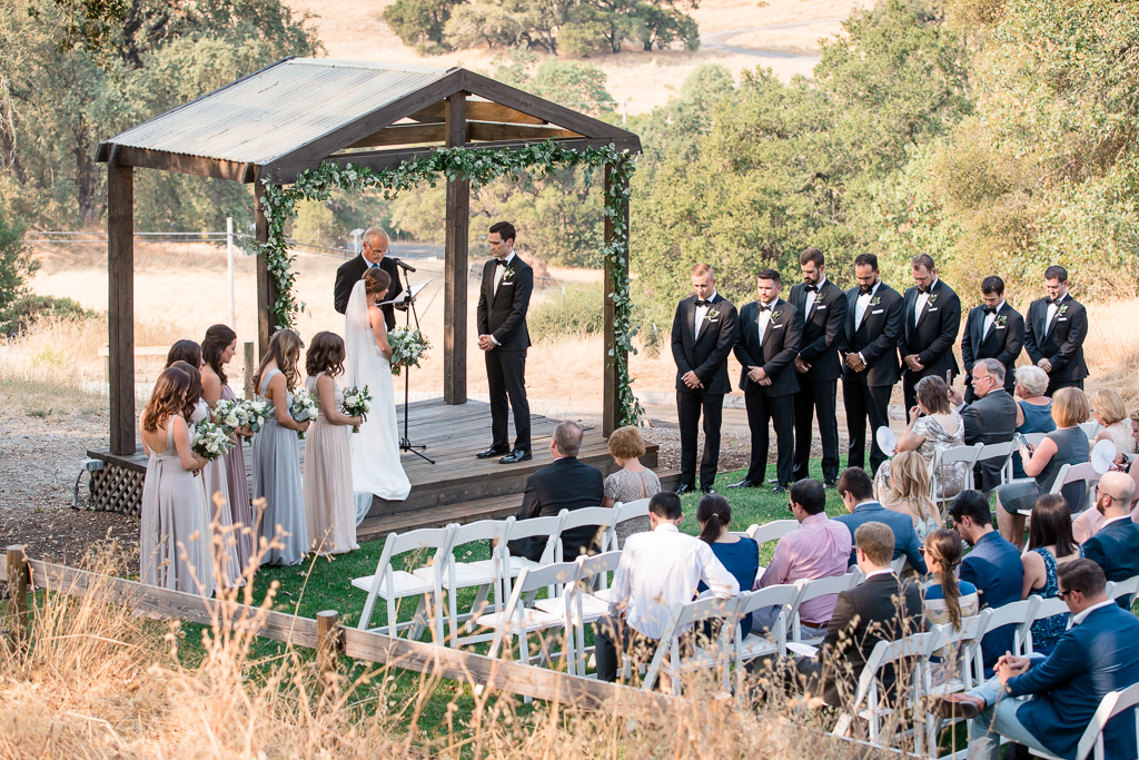 outdoor wedding ceremony surrounded by the mountains and vineyards