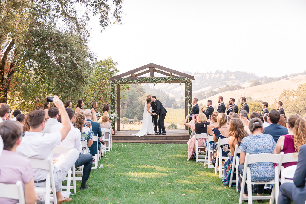 bride and groom's first kiss as husband and wife - Sonoma real weddings