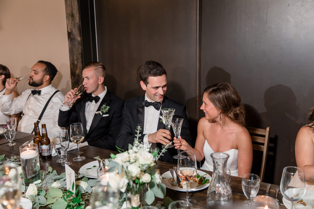 bride and groom enjoying their food and drinks