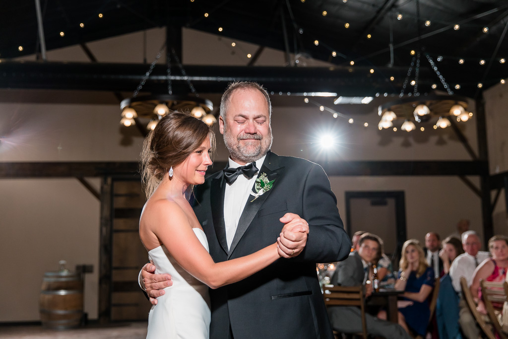 an extremely emotional father daughter dance during the wedding reception at the highlands estate