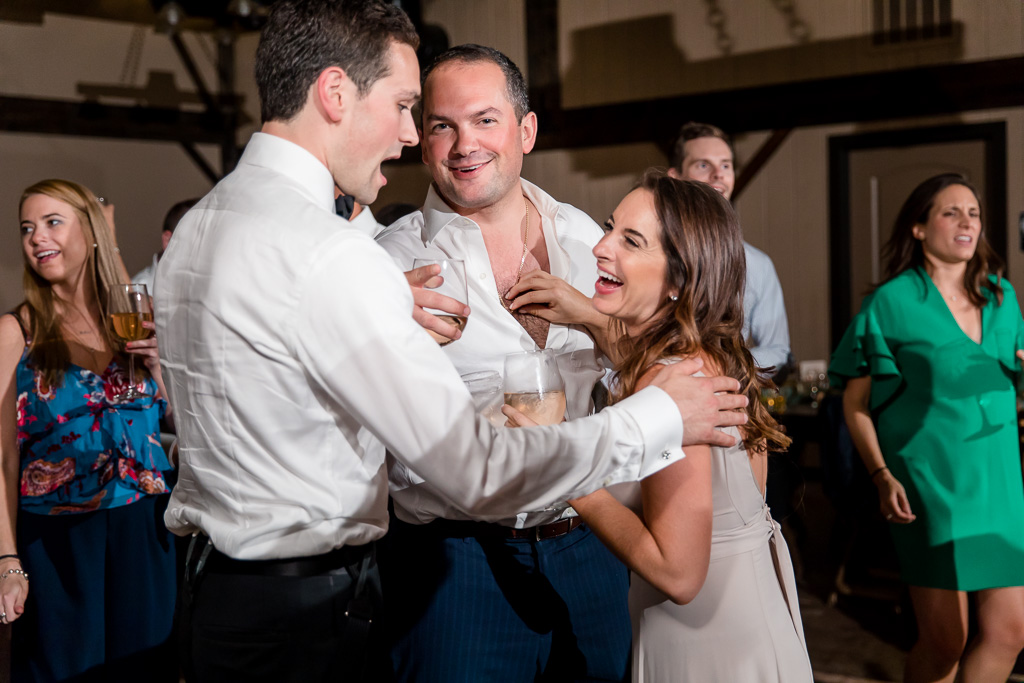 bridesmaid hilariously pulling chest hair from her husband