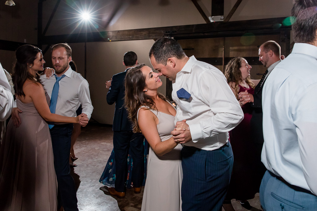 bridesmaid and her husband enjoying their time on the dance floor