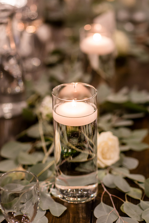 floating candles and leaves wedding ceterpiece