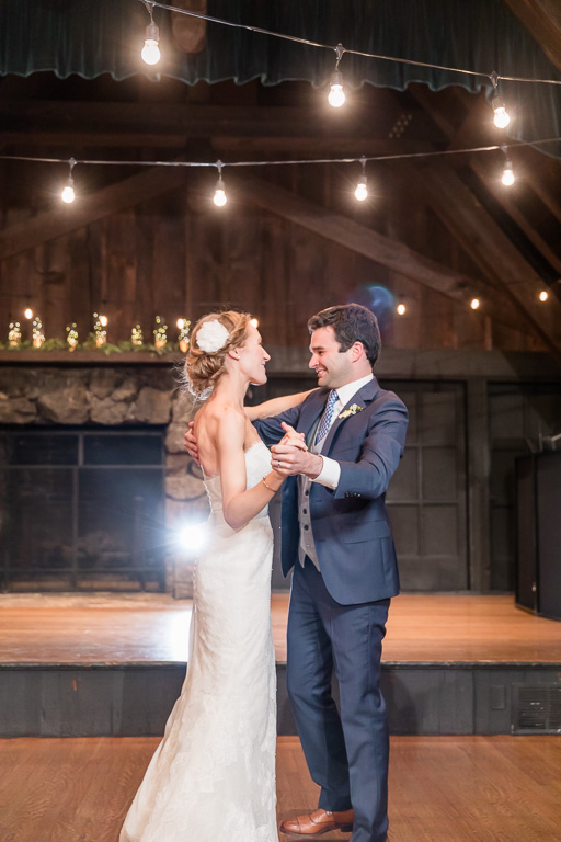 newlyweds' first dance as husband and wife in front of a stage