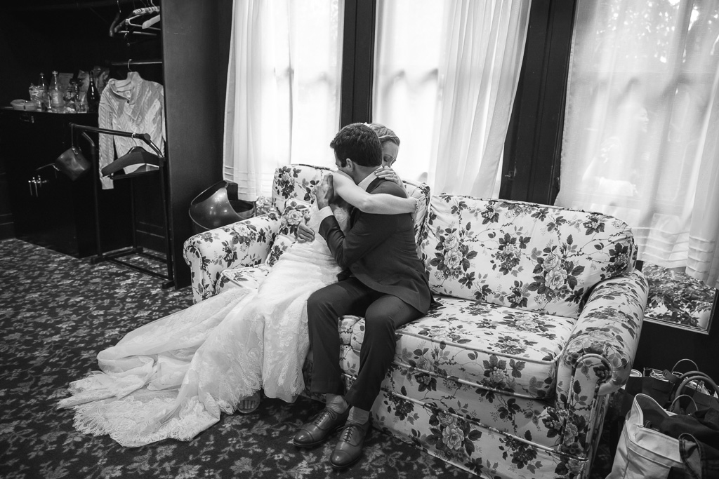 candid photo of bride and groom's alone time after wedding ceremony
