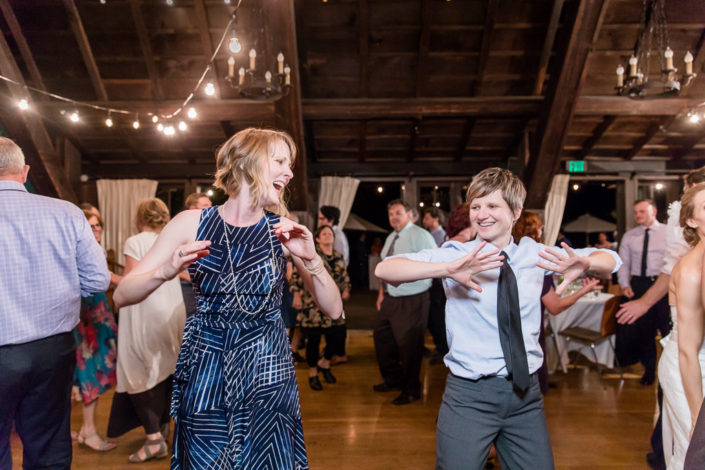 wedding guests showing their dance moves out on the dance floor