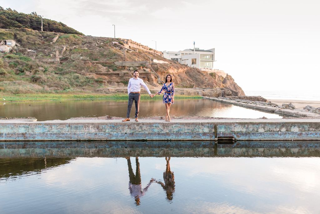 engagement photo with cliff house in the background