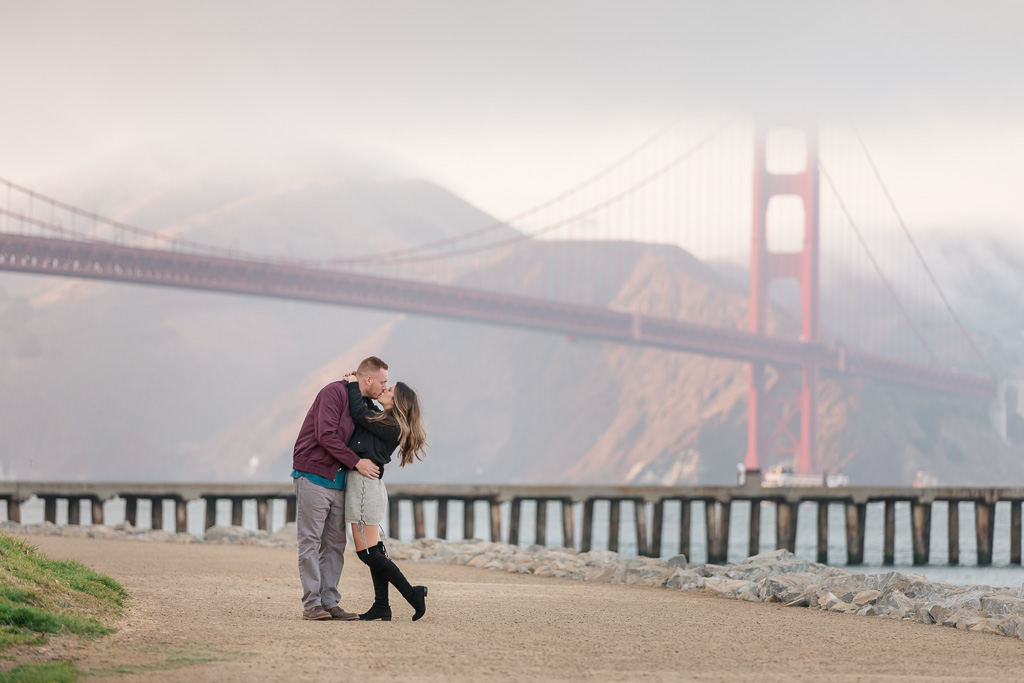 kiss near foggy Golden Gate Bridge