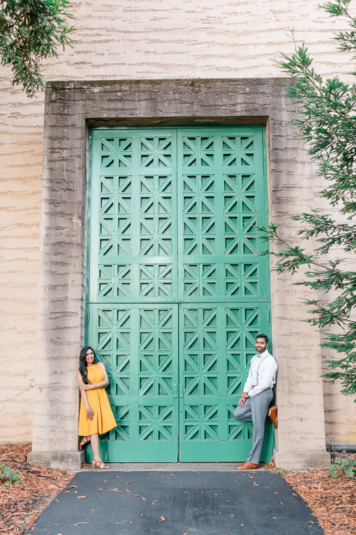 unique engagement photo idea at Palace of Fine Arts big green door