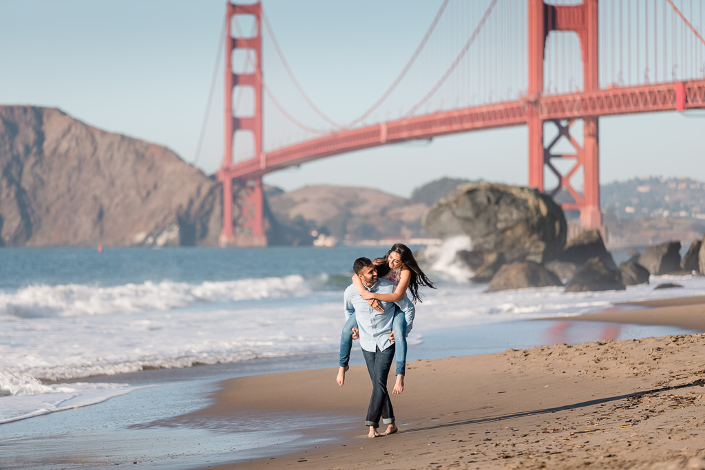 piggyback right along ocean beach shore with Golden Gate Bridge background