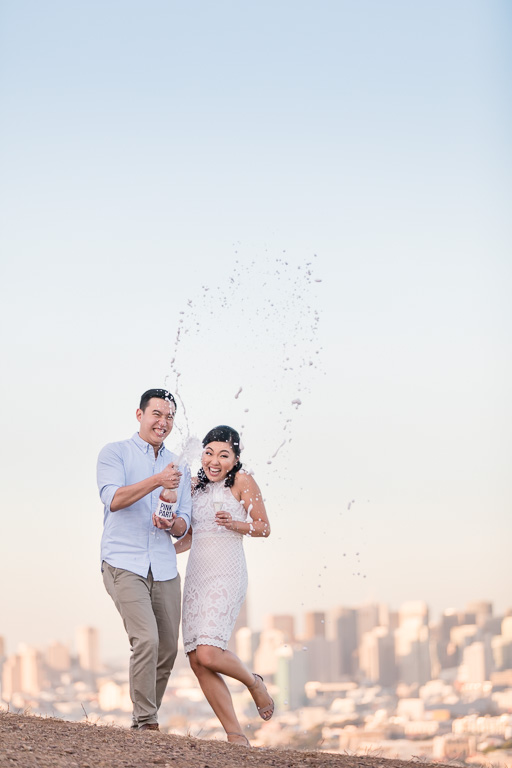 champagne shooting out of bottle engagement photo idea