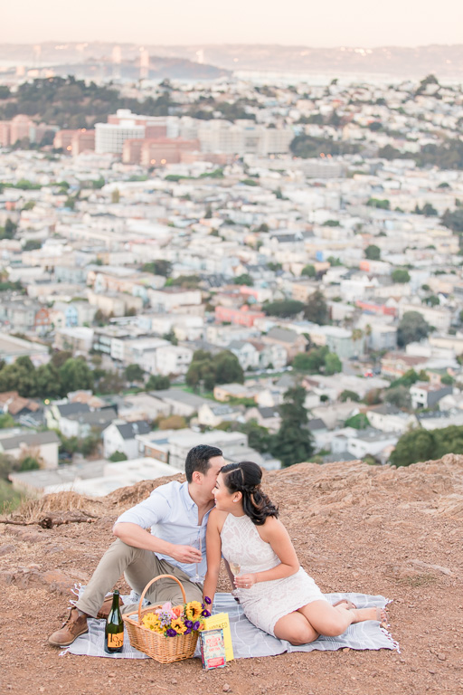 romantic picnic setting engagement photo in San Francisco with city skyline