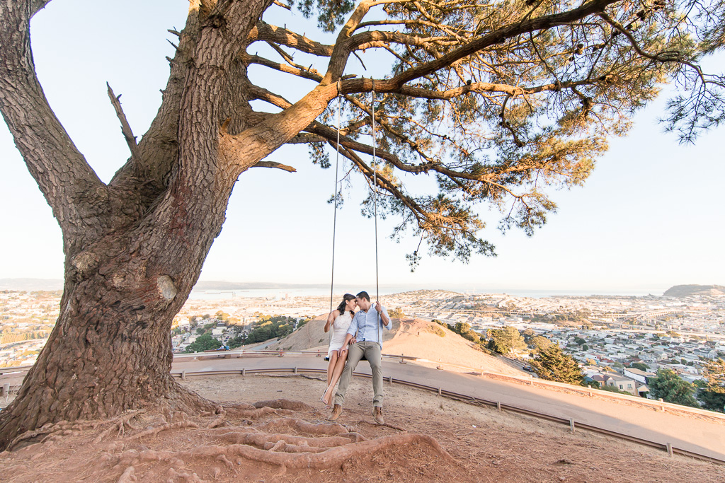 pretty photo of couple on Bernal Heights wooden swing