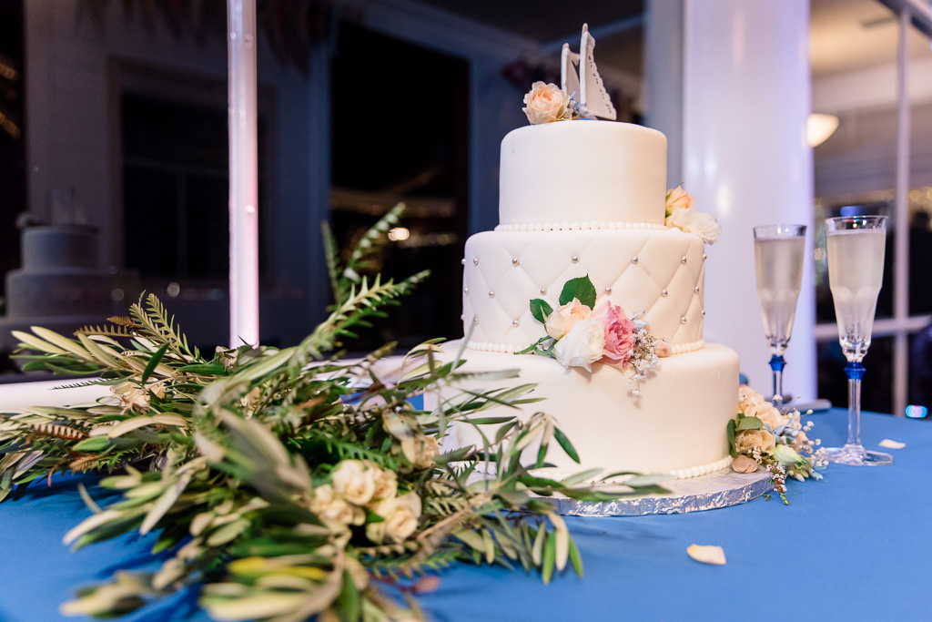 pretty sailing themed wedding cake with fresh flowers