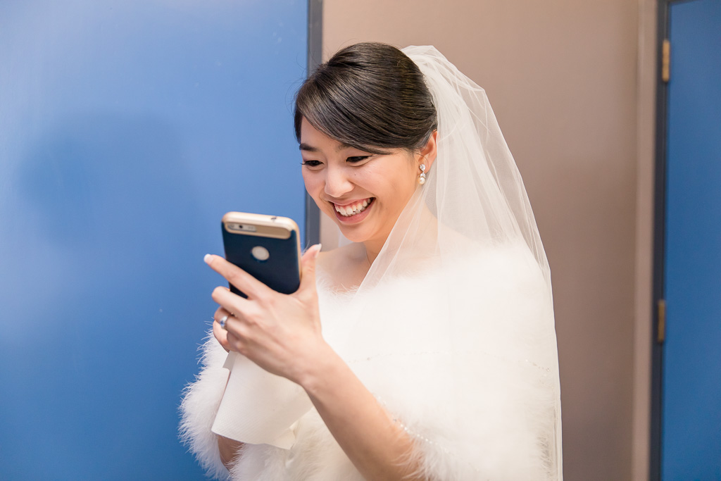 bride watching the boys playing games from inside