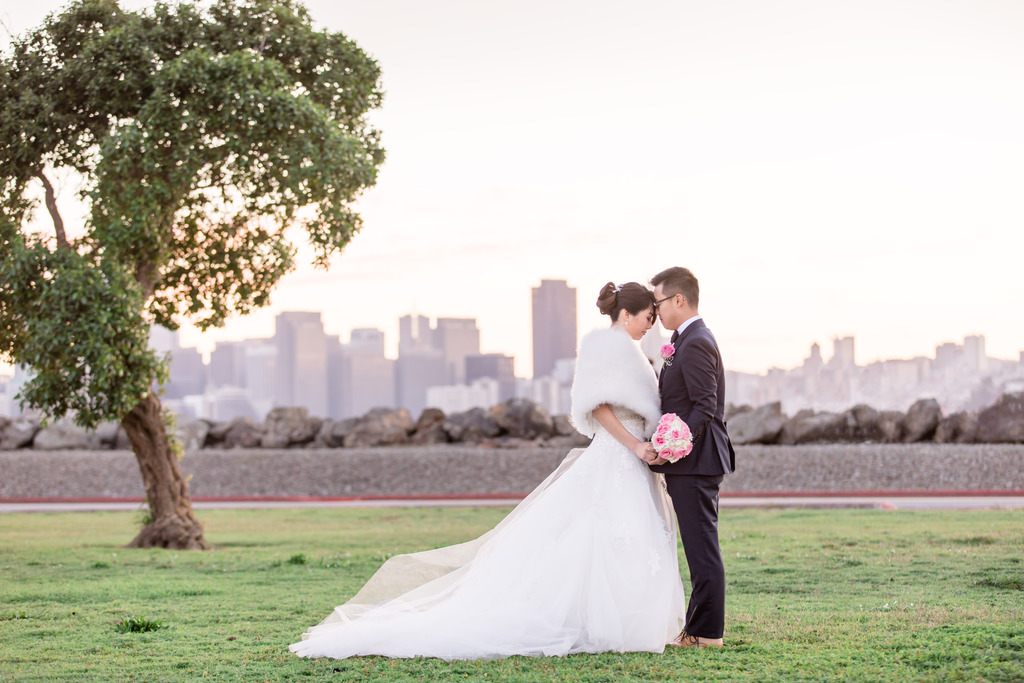 bride and groom portrait with San Francisco downtown in the background