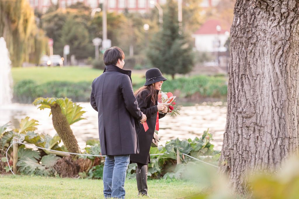 he pulled out a card and a rose bouquet to surprise her before the proposal