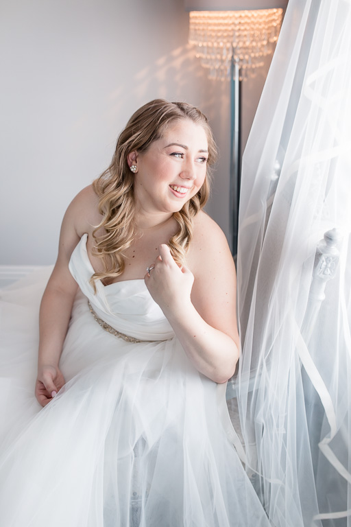 bride getting ready in the elegant willow heights mansion bridal suite