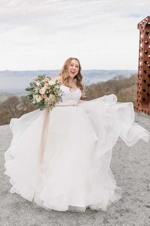 bride twirling around in her wedding dress
