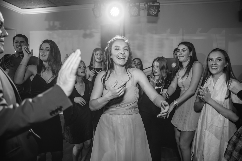 bridesmaid dancing in the middle of the dance floor