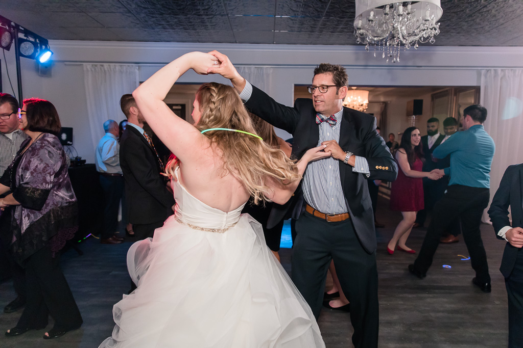 bride dancing with a wedding guest