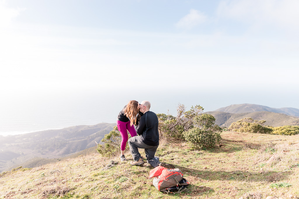 surprise marriage proposal with sweeping panaramic view of Half Moon Bay mountains