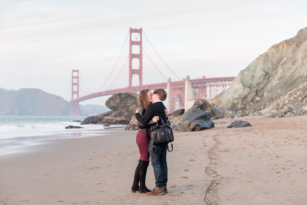 kiss in front of the golden gate bridge