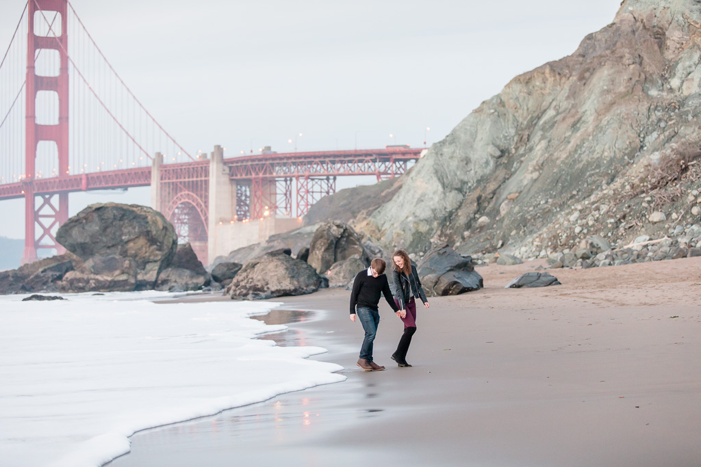Marshall's beach engagement photo overlooking the golden gate bridge