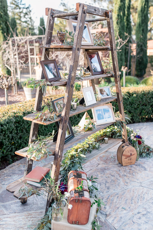 wooden rustic ladder beautifully decorated with picture frames at Regale winery