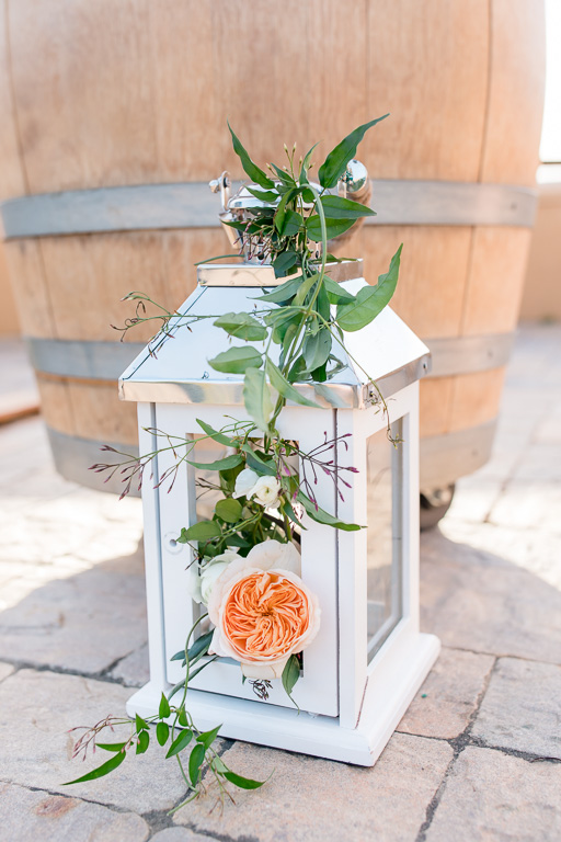 white wedding lantern filled with fresh flowers