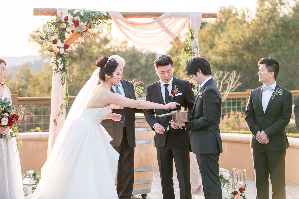 sealing their vows in a wine box