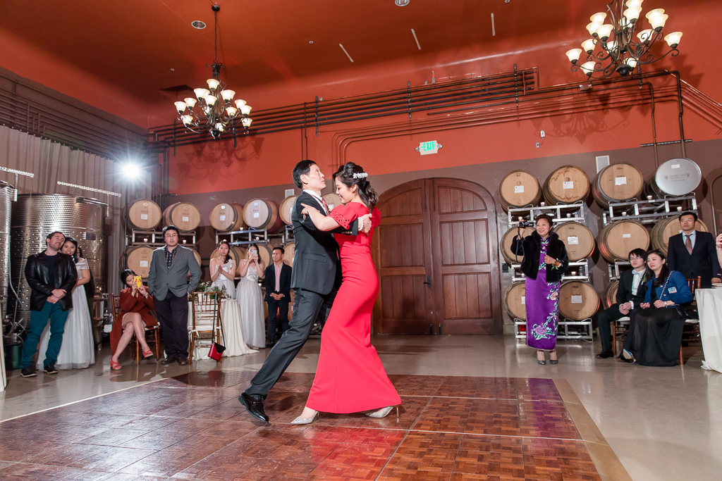 bride dancing with her father in the barrel room