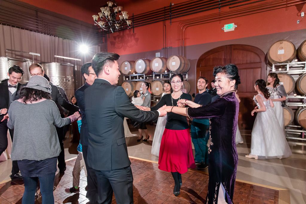 groom dancing with his family