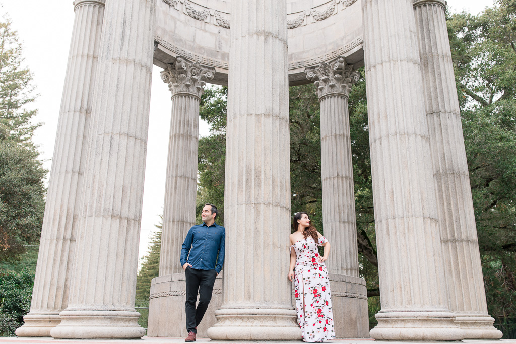 couple standing by greek columns