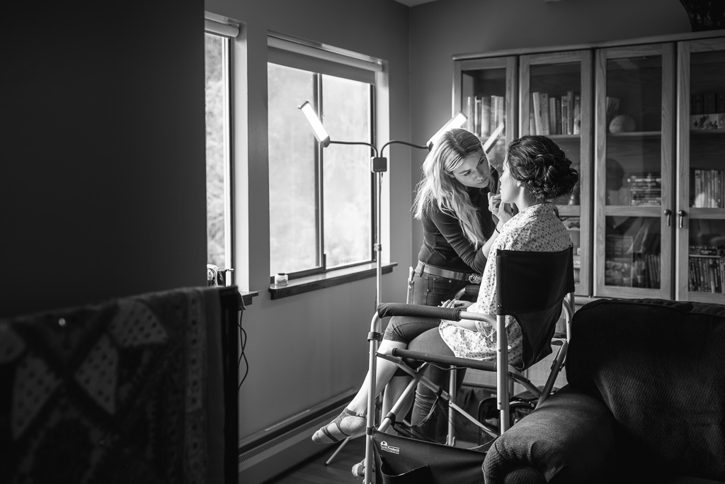 bride having her makeup done at an airbnb
