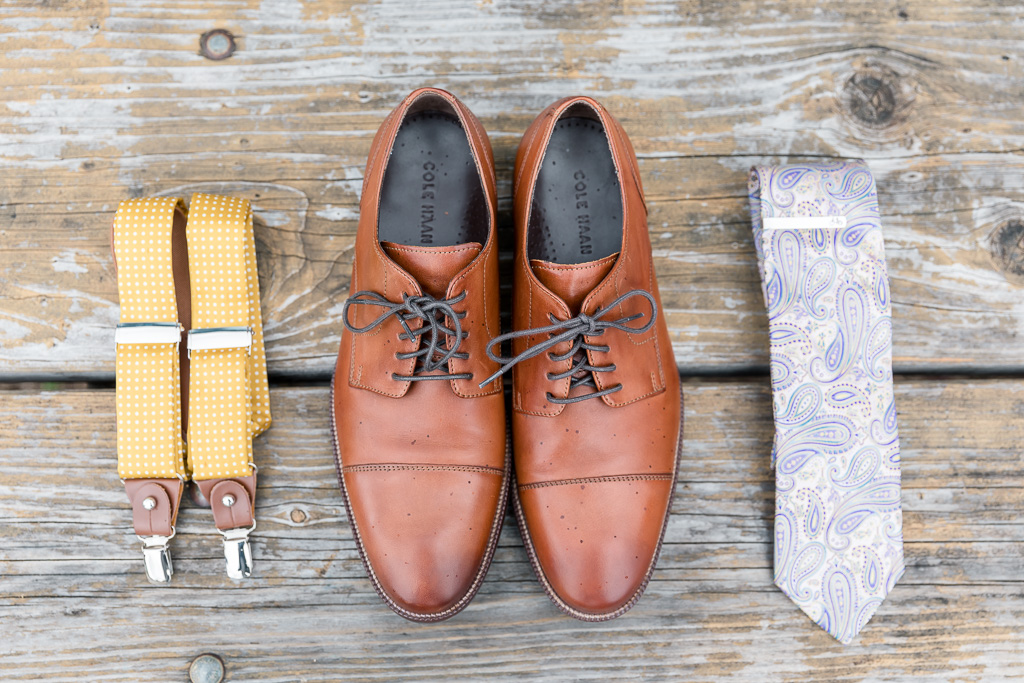 groom's details - suspenders, shoes, and tie